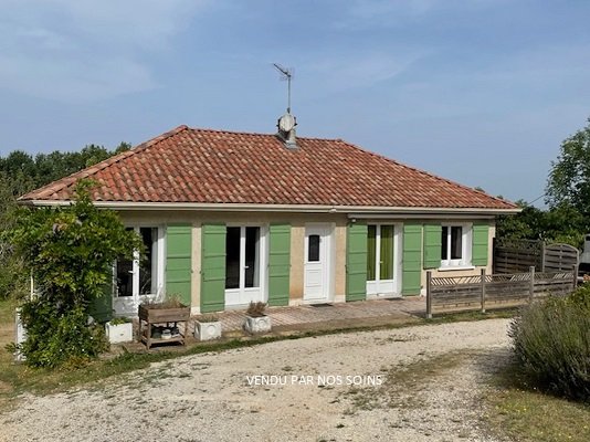Plain-pied sur sous-sol avec garage et terrain