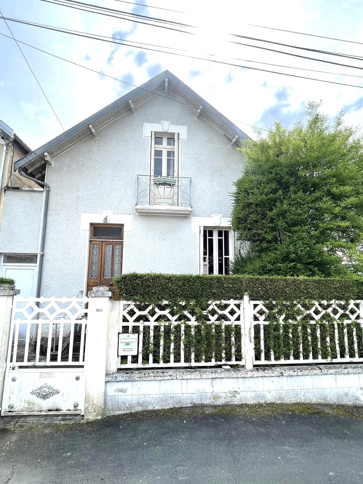 Maison de type Loi Loucheur avec jardin.